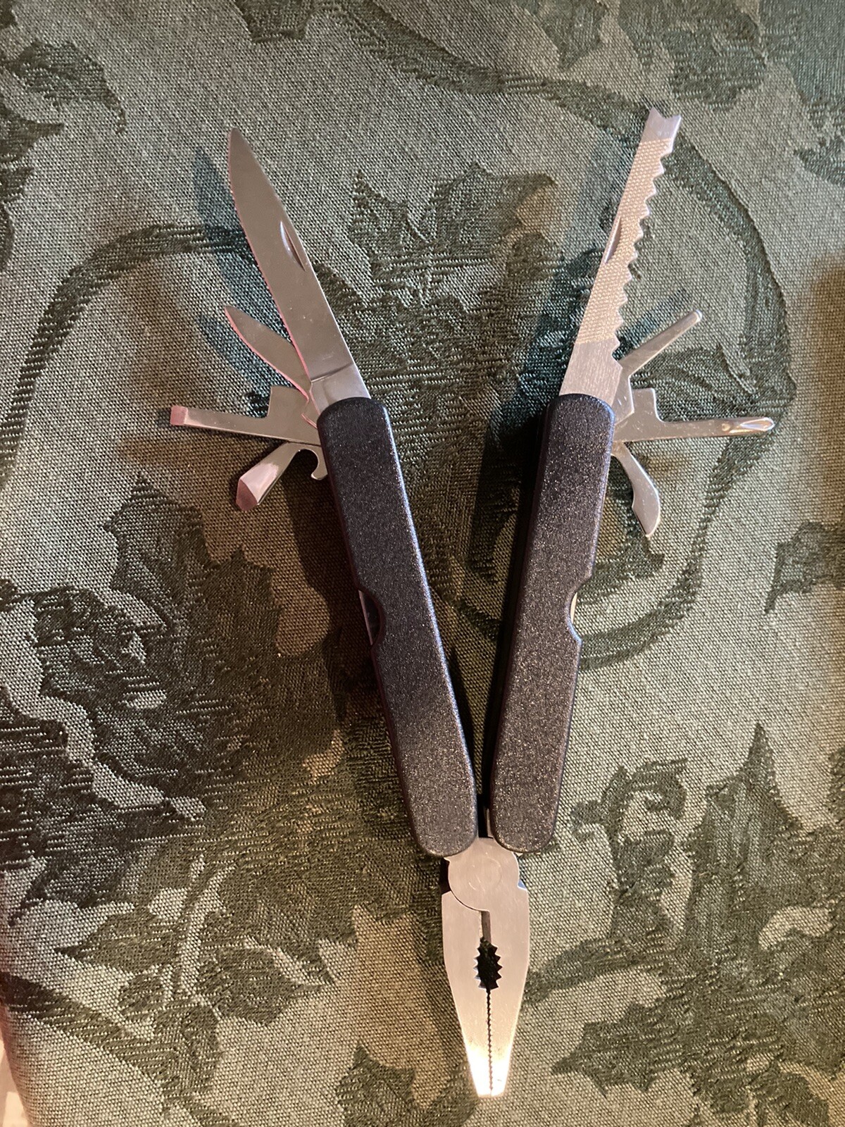 Plier Multi Tool with knife, screwdrivers, can opener, bottle opener, etc.