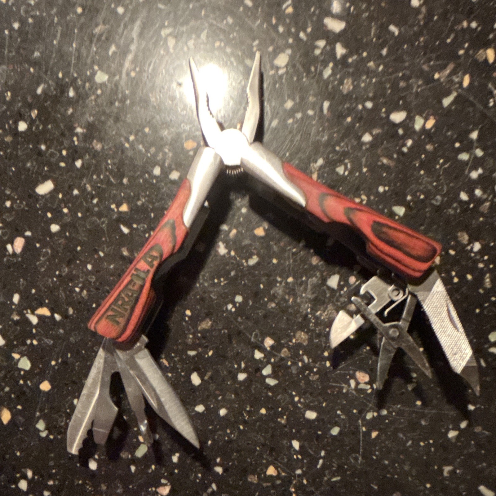 NRA II-A 11-in-1 Folding Multi-Tool Pliers 2″ Straight Blade Red/Black Sheath