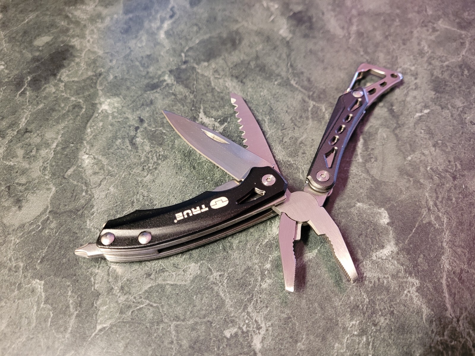 True Utility TU180F Seven Multi-Tool Saw Knife wire cutters Pliers Screwdriver