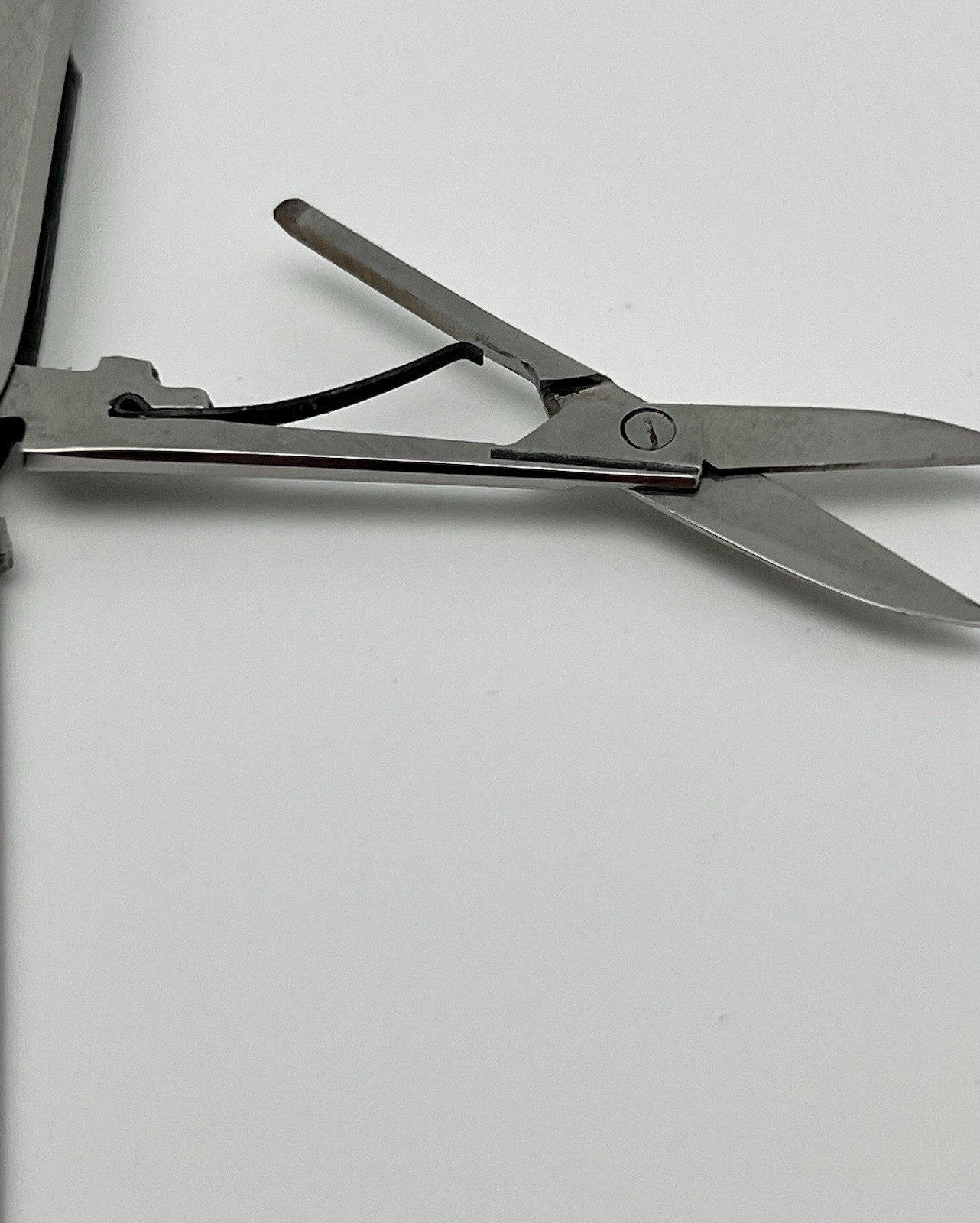 Multi-tool with blade, scissors and file