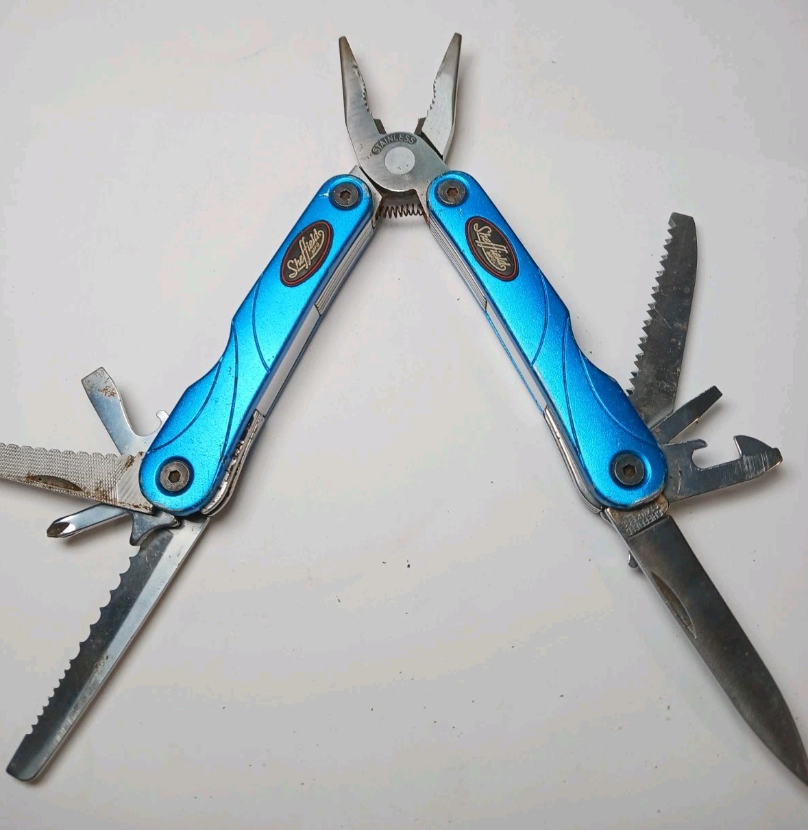 Sheffield Multitool Blue Handle Pliers Saw Knife Screwdrivers – Used