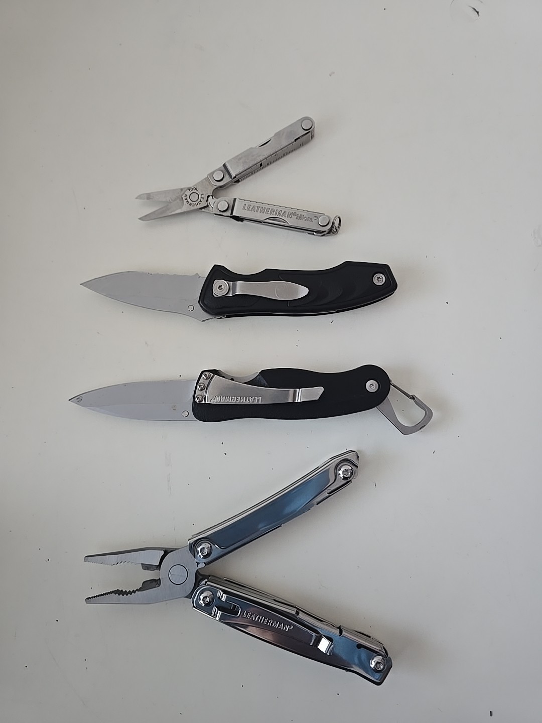 Lot of 4 – Leatherman Multi-Tools – Micra, C33, C301, REV