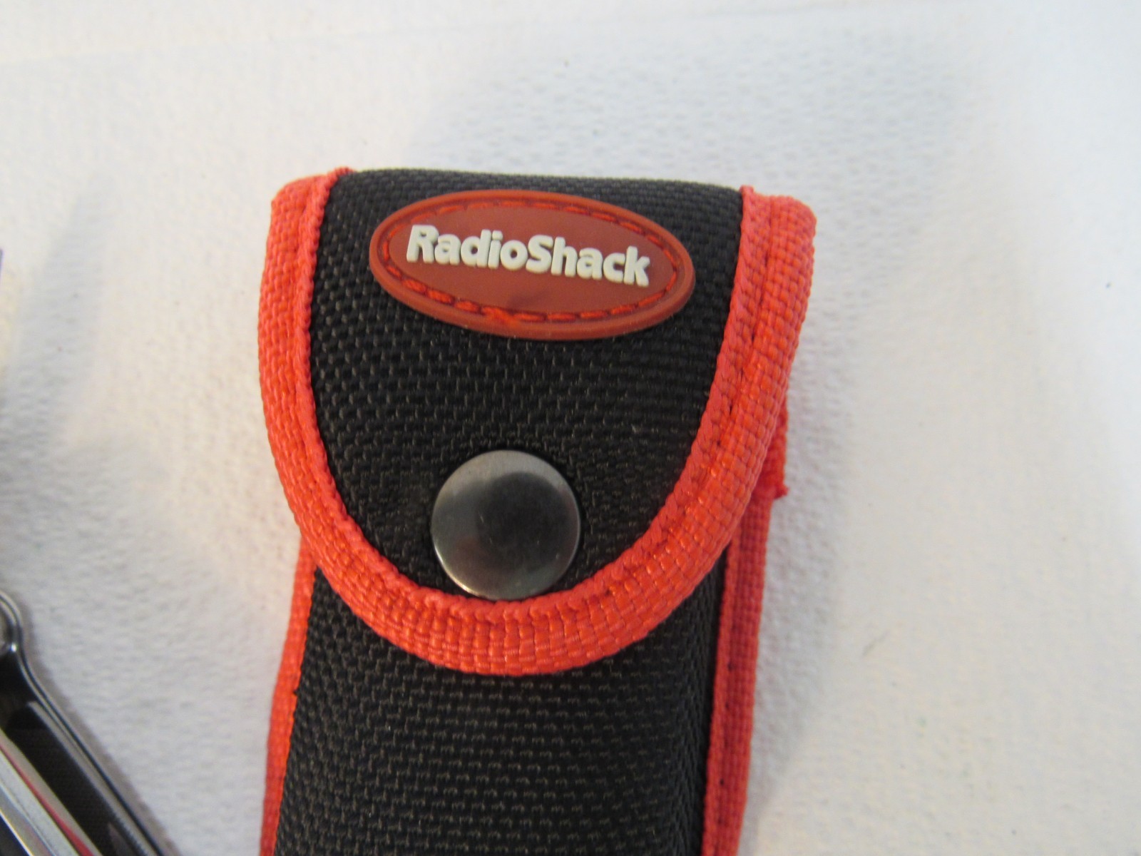Radio Shack Multi-Tool Stainless Steel With Belt Case Red, Black, Stainless