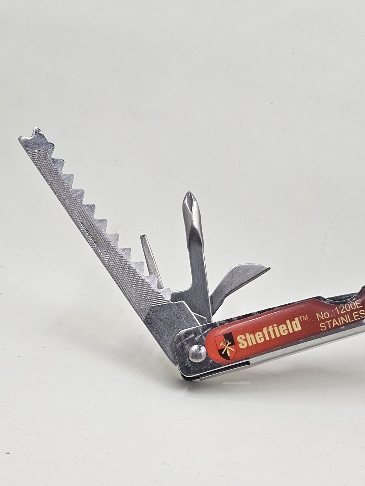 Sheffield No 1200E Stainless Steel Multi Tool Pliers Saw Knife Red Handle 4in