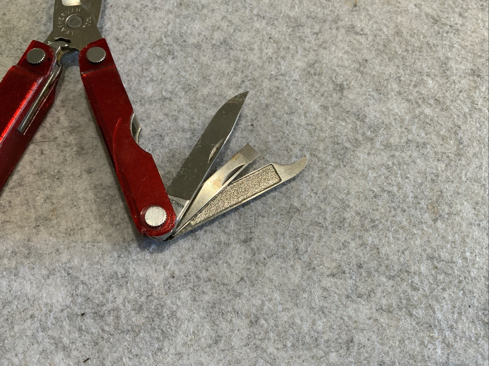 Leatherman Micra Multi Tool Red Transparent Plastic Coating Chipped