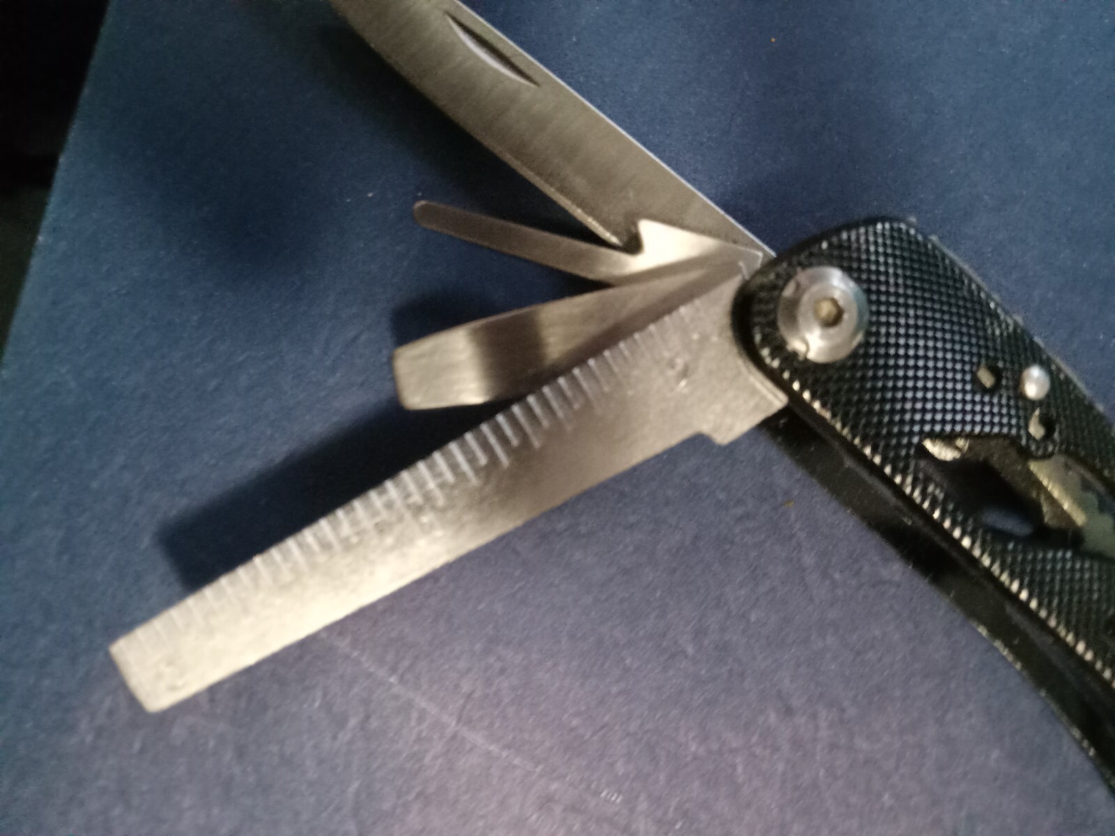 9 Multi-tool Black, no brand name with knife, plies, file, etc