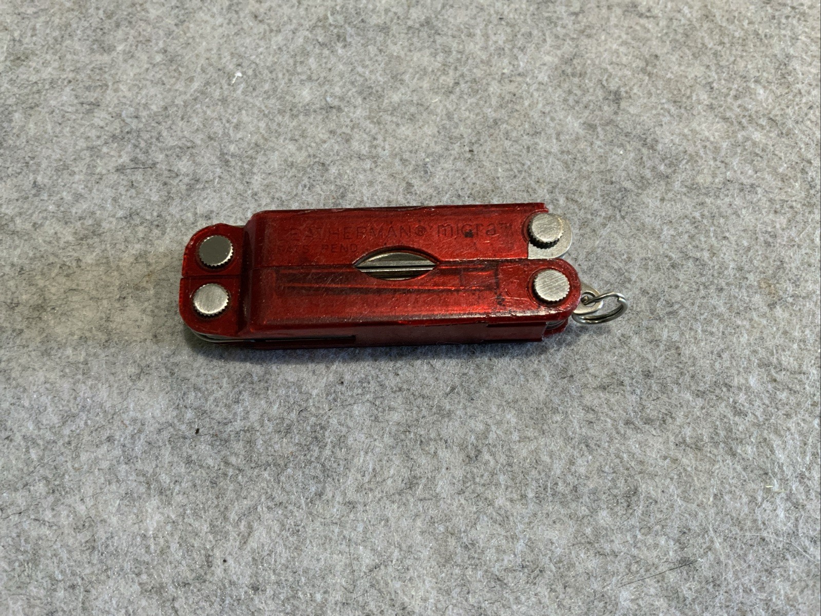 Leatherman Micra Multi Tool Red Transparent Plastic Coating Chipped