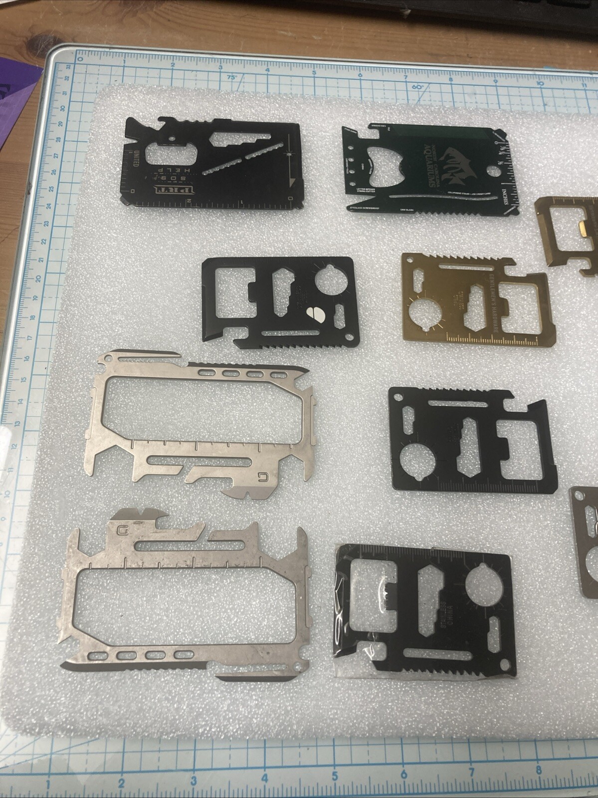 10 USED Various/Multicolor TSA Confiscated Metal Survival Wallet Cards. A STEEL!