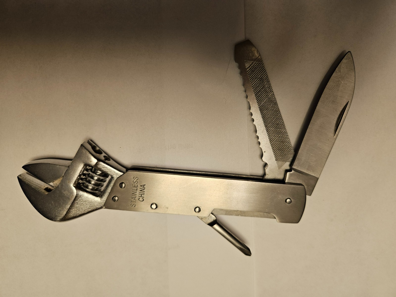 Stainless steel multi-tool with wrench