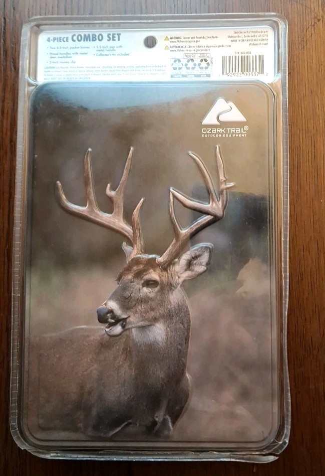 OZARK TRAIL 4 PIECE COMBO SET 2-6.5″ KNIVES DEER TIN MONEY CLIP & PEN NIB