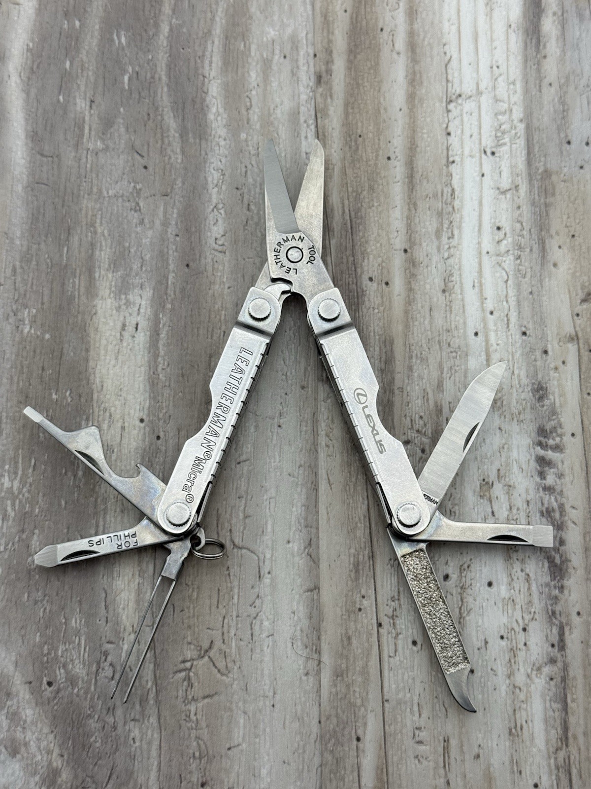 Leatherman Micra Multi-Tool Knife Scissors Key Ring Stainless Lexus logo