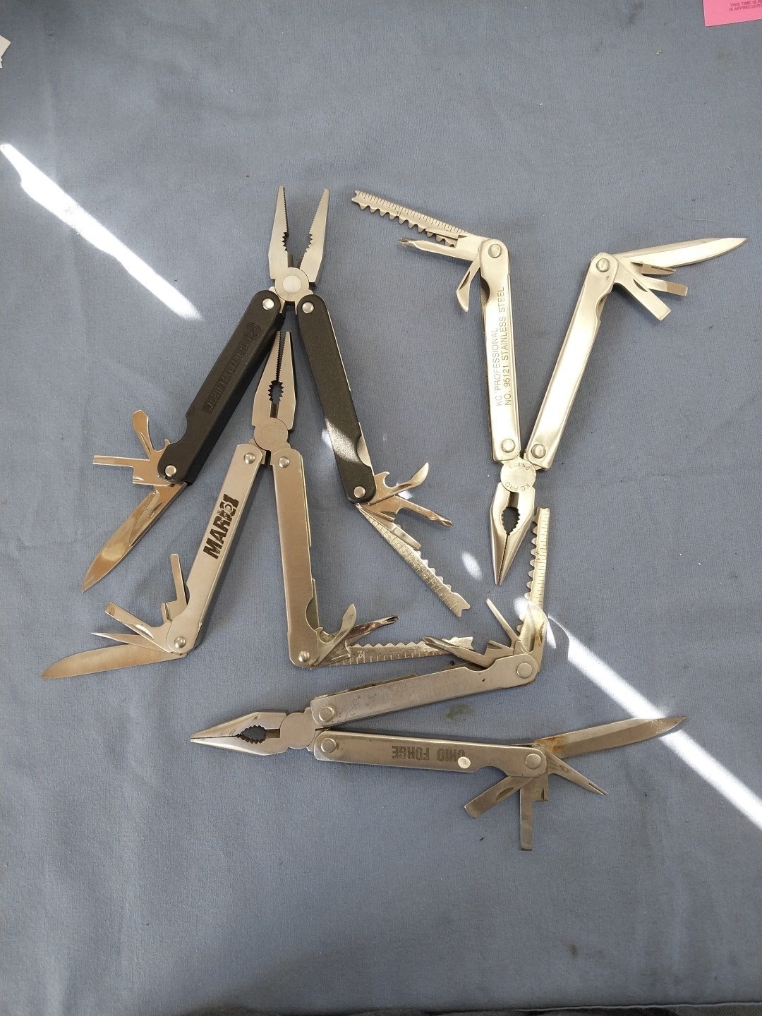4 multi tools pliers screwdriver knife saw