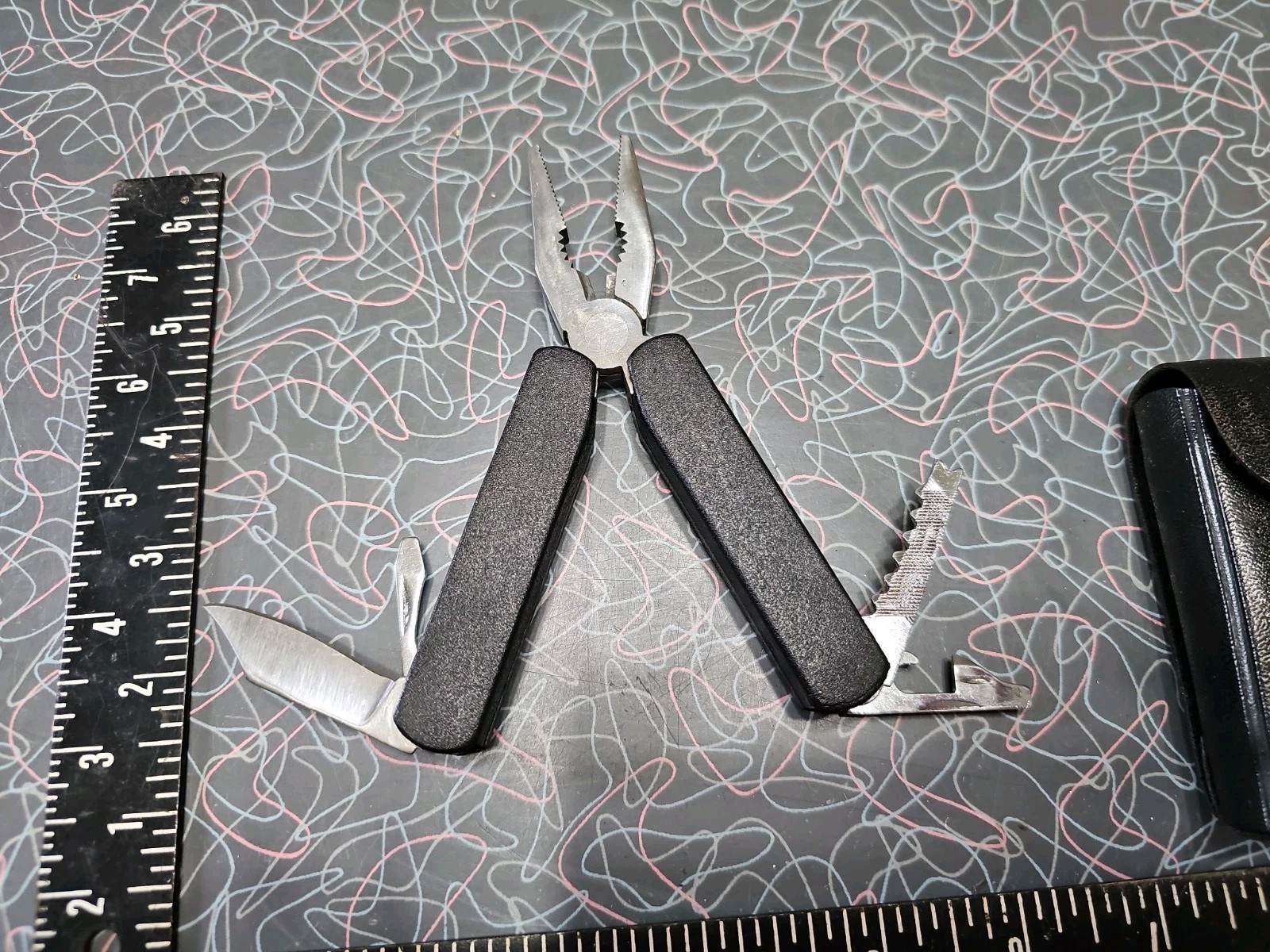 Vintage Multi-Tool with Black Belt Sheath Made in China Pliers Knife Screwdriver