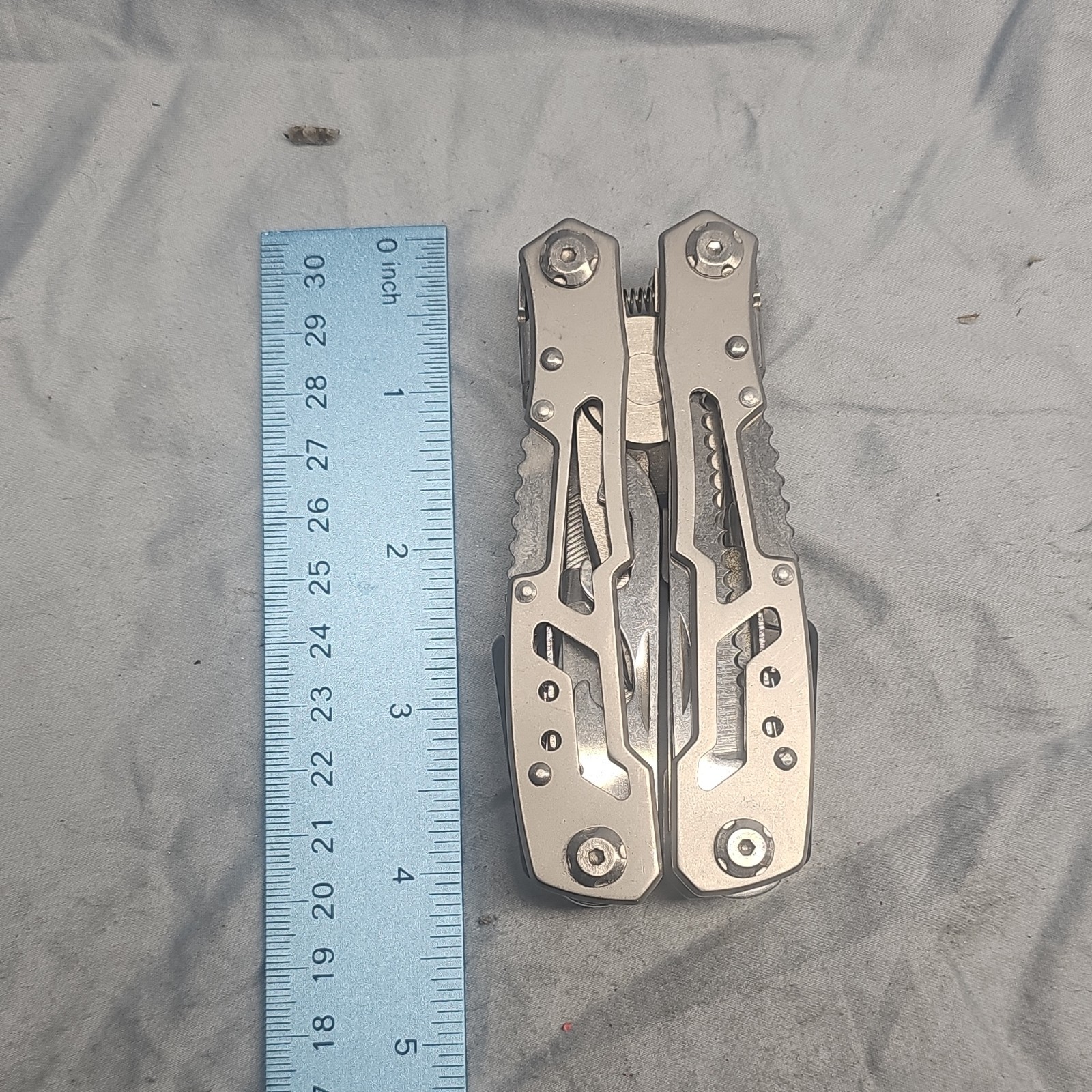 Silver Stainless Steel Multi-Tool with 7 Tools: Plier, Knife, File