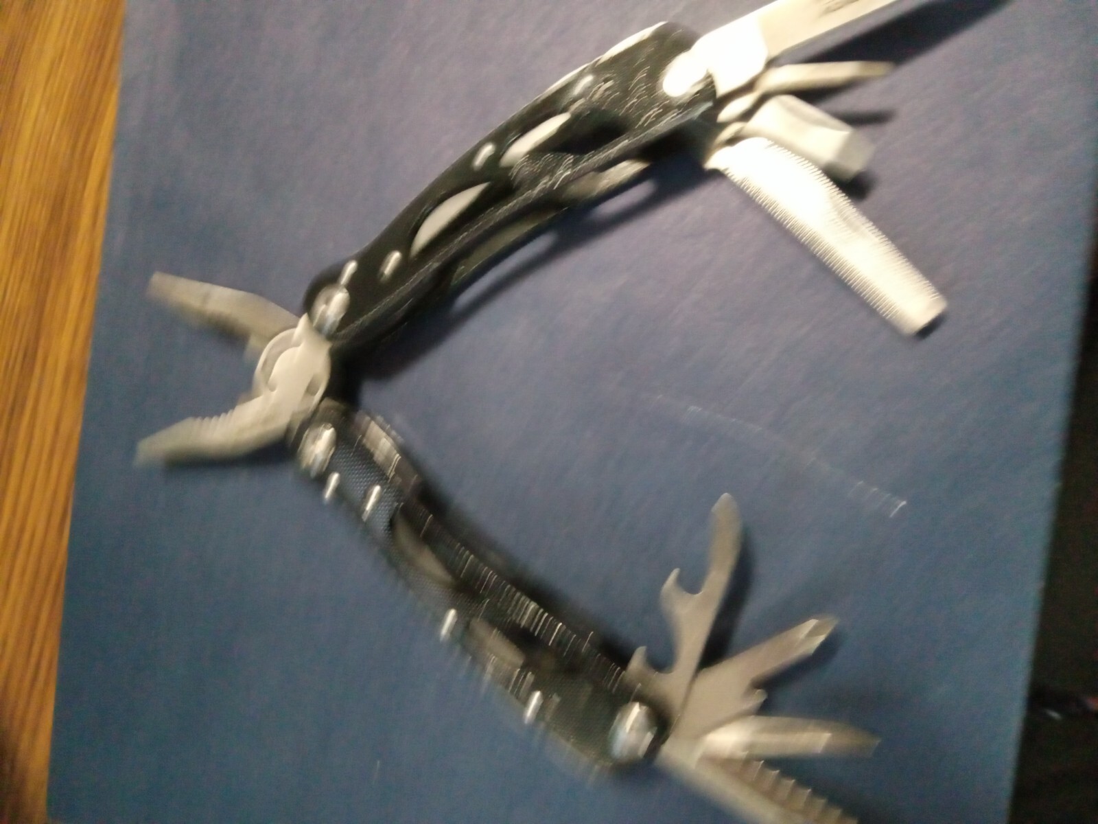 9 Multi-tool Black, no brand name with knife, plies, file, etc