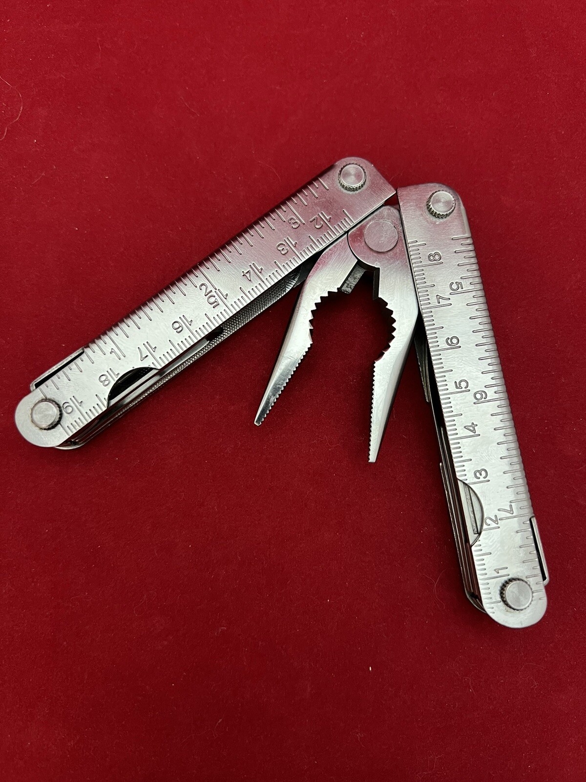 Stainless Steel 12-in-1 Multi-Tool – Pliers Knives Screwdrivers File Saw Opener