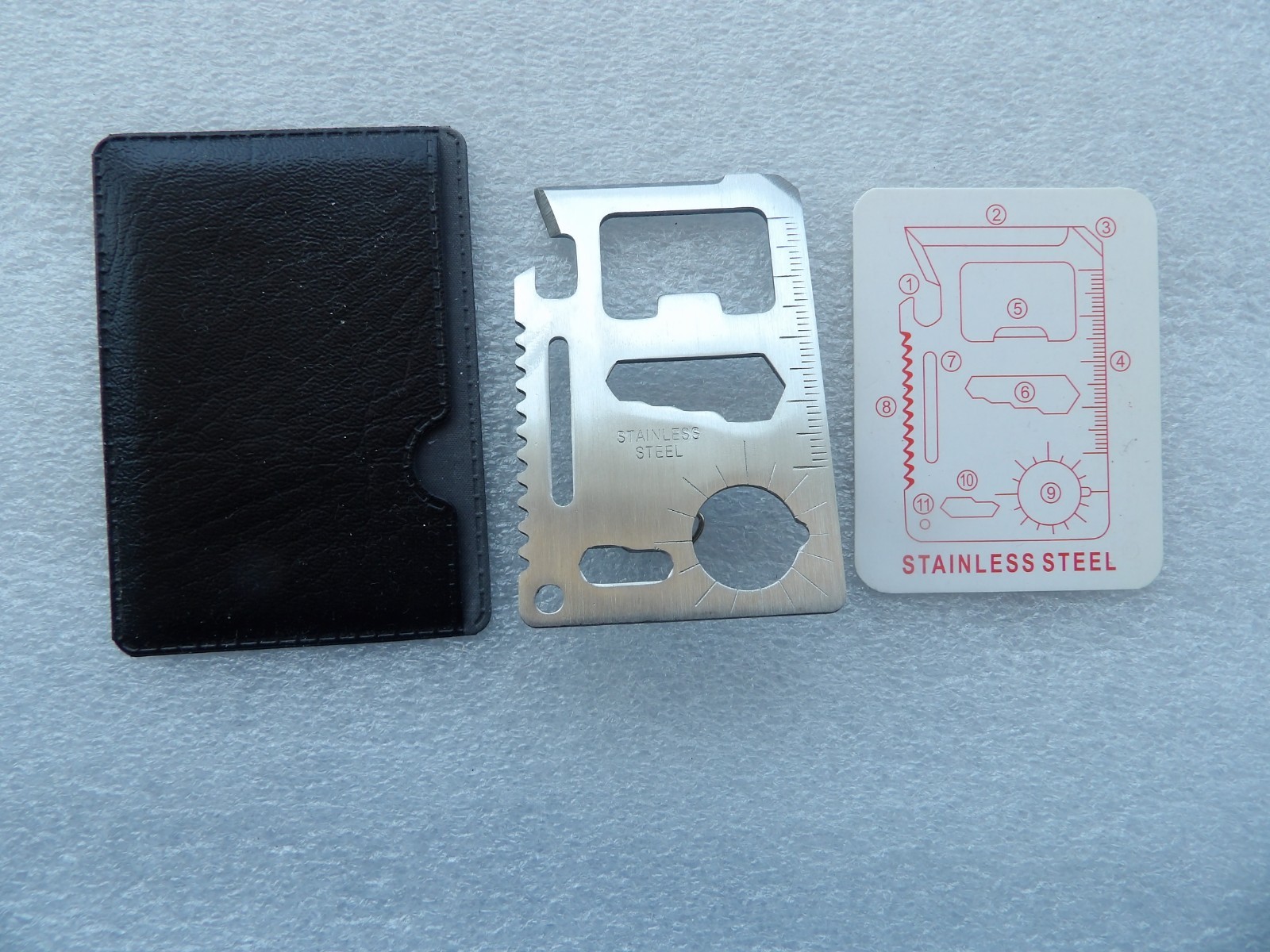 Wallet-sized stainless steel multi-tool with 11 different functional features