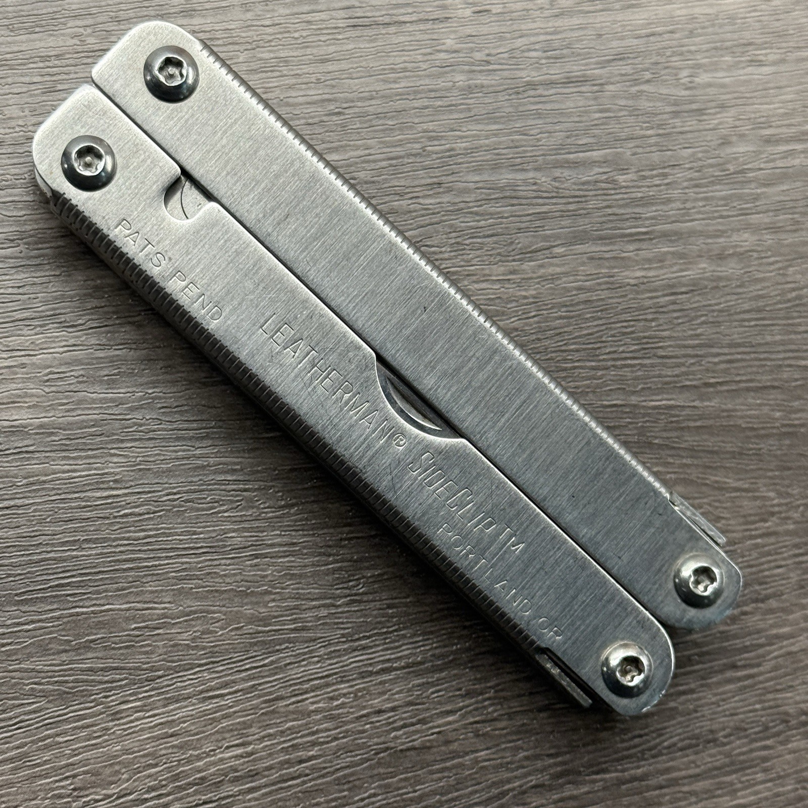 Leatherman Sideclip multitool. Lightly used. Late Run: shiny factory polished