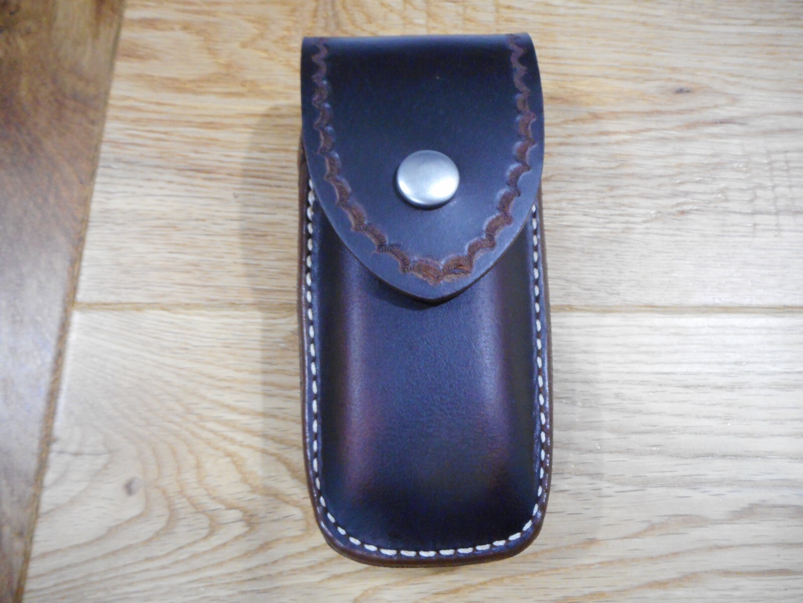 Leatherman Surge. Crazy Horse leather sheath. Tooled flap. Sheath only.