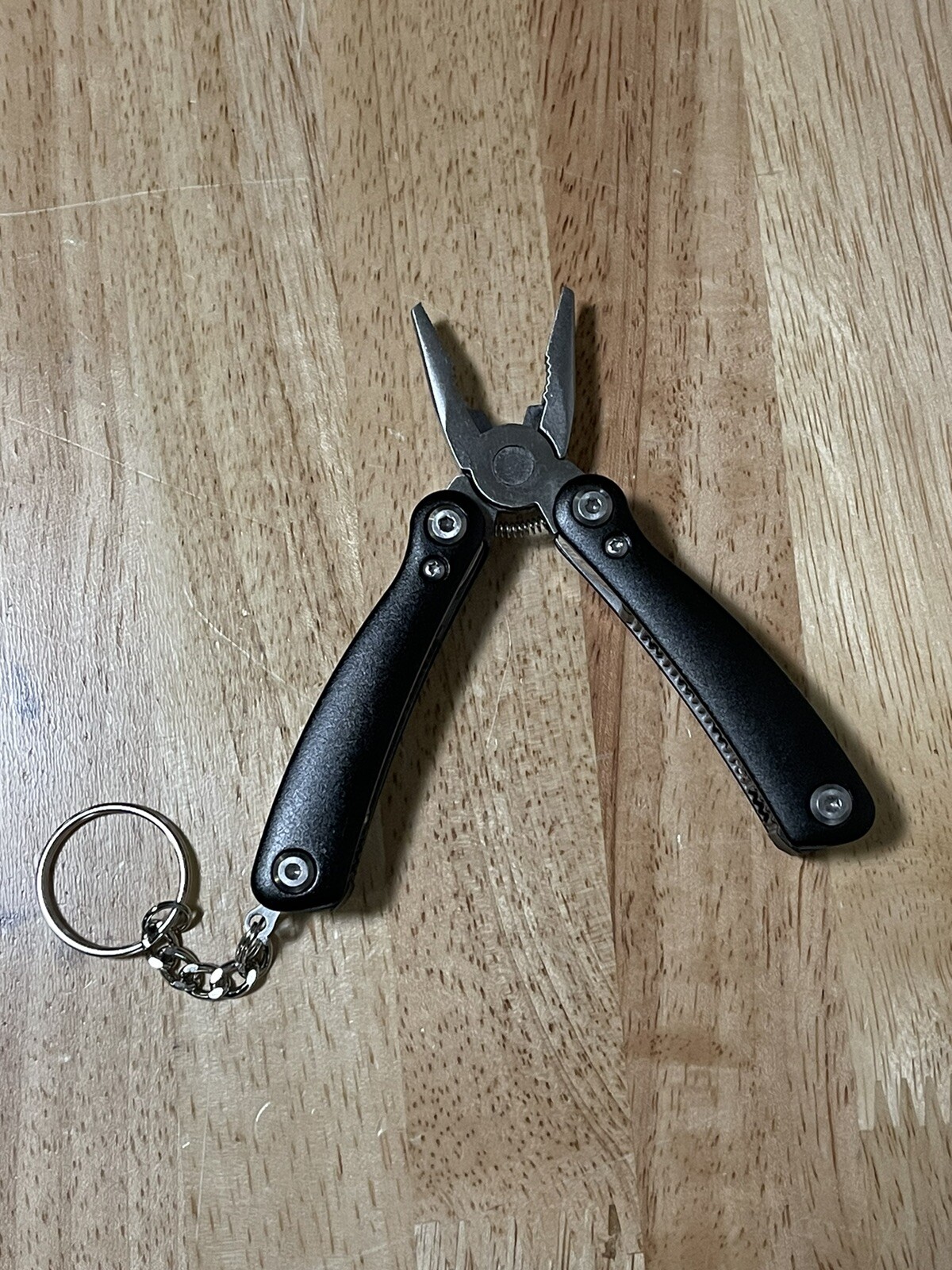 Sarge Mini 10 In 1 Black Zytel Stainless Steel Multi Tool Company Logo