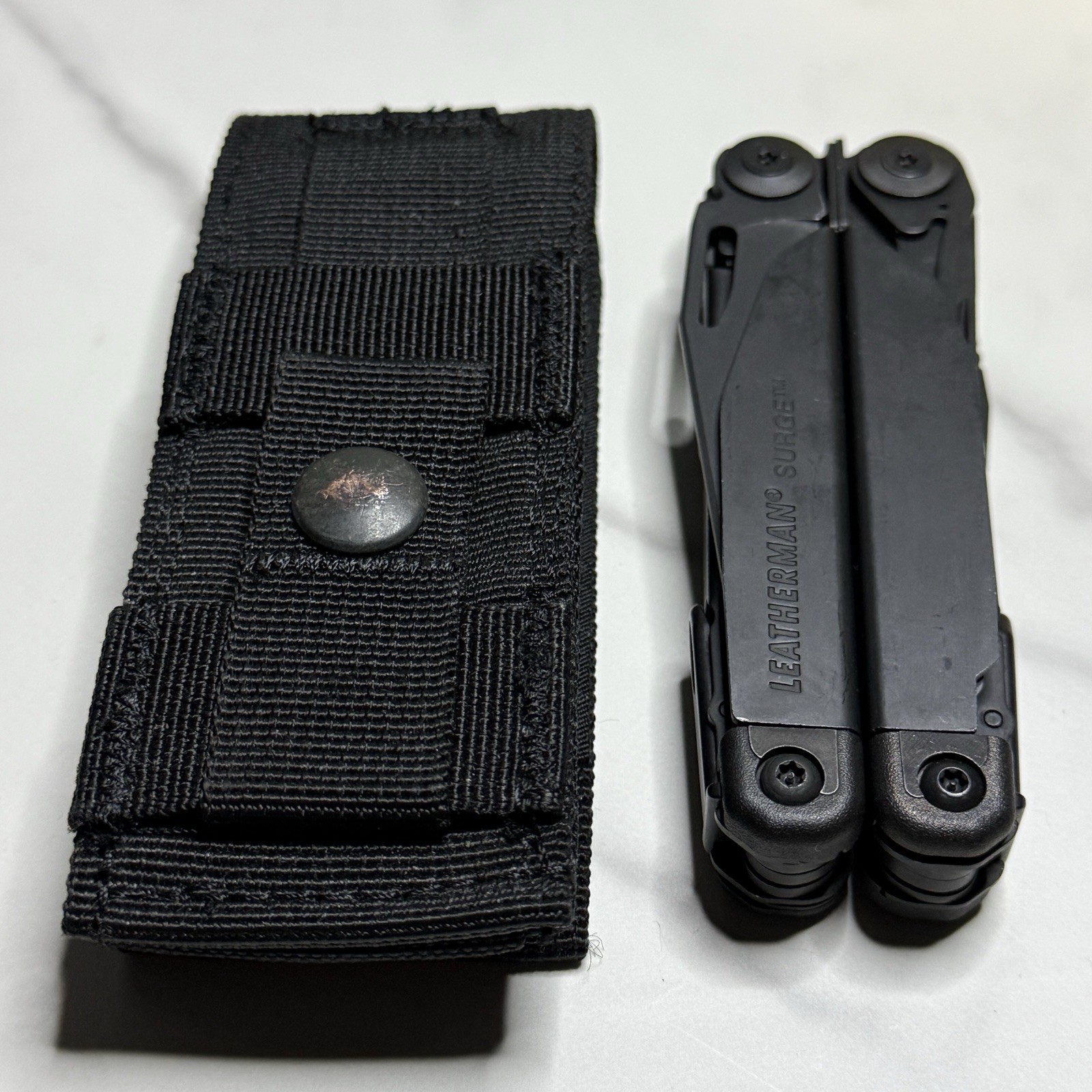 Leatherman Surge Cap Crimper Black Multitool w/Molle Sheath. Discontinued