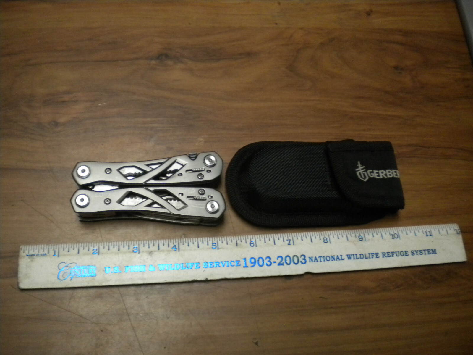 Gerber Suspension Multi-Tool with black nylon belt sheath in used excellent con