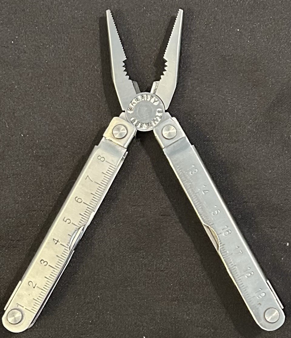 4” Garrett Stainless Multi Tool w/Case Saw/Bottle & Can Opener/File/Screwdriver/