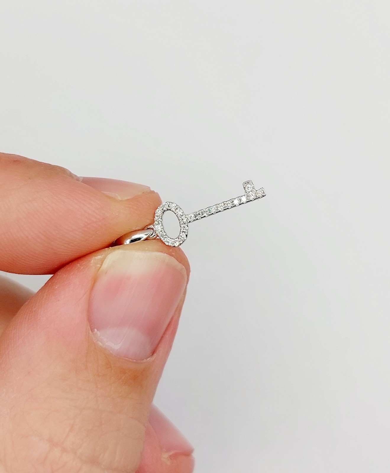 Vintage 18k white gold key pendant pavé-set with diamonds