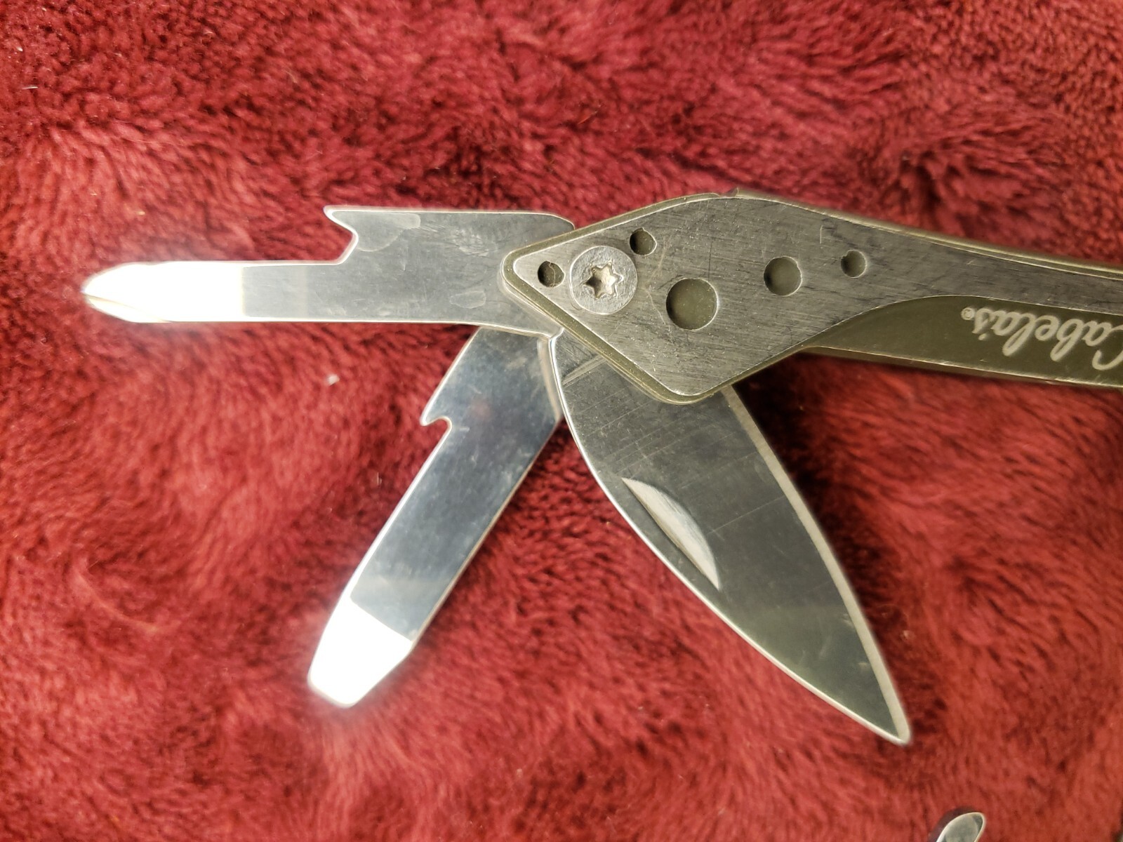 Lot of three Cabela’s Multi Tool Stainless Clear, Teal Green & Red