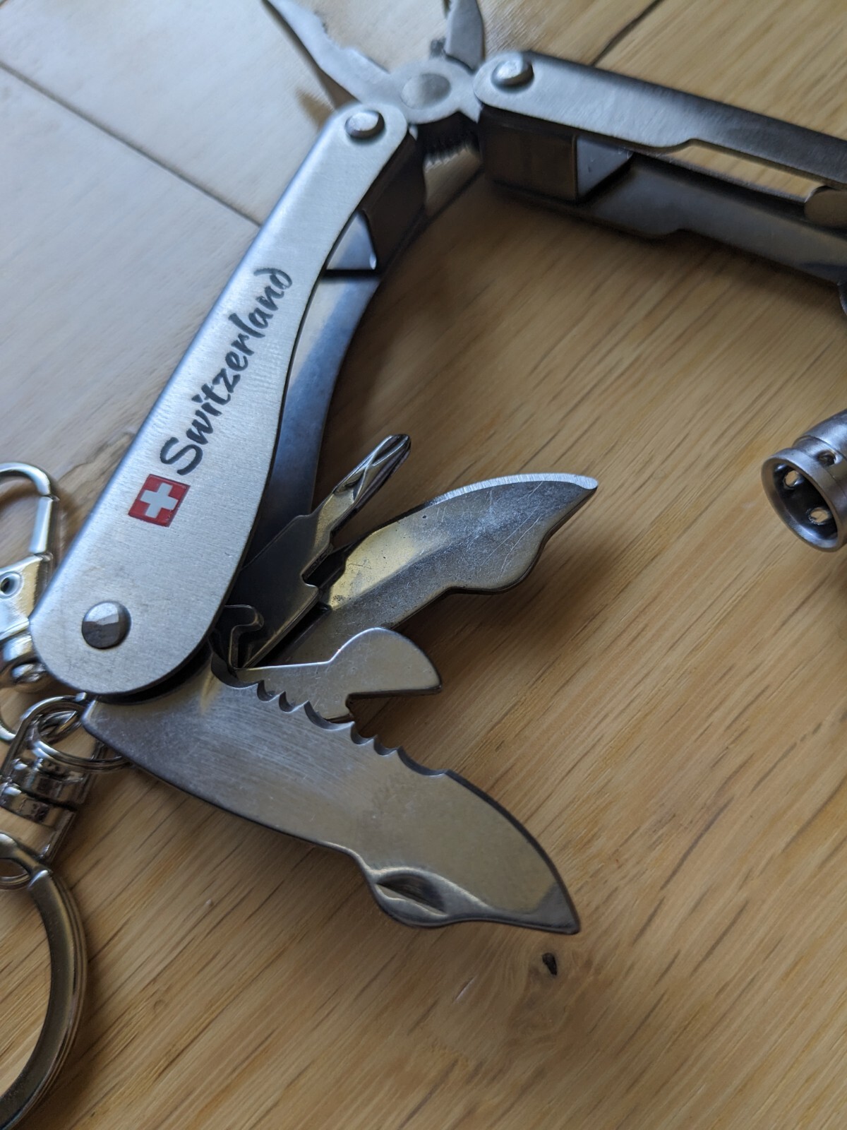 Swiss-Made Foldable Pocket Multi-Tool Stainless Steel w Pocket Clip. 8 Functions
