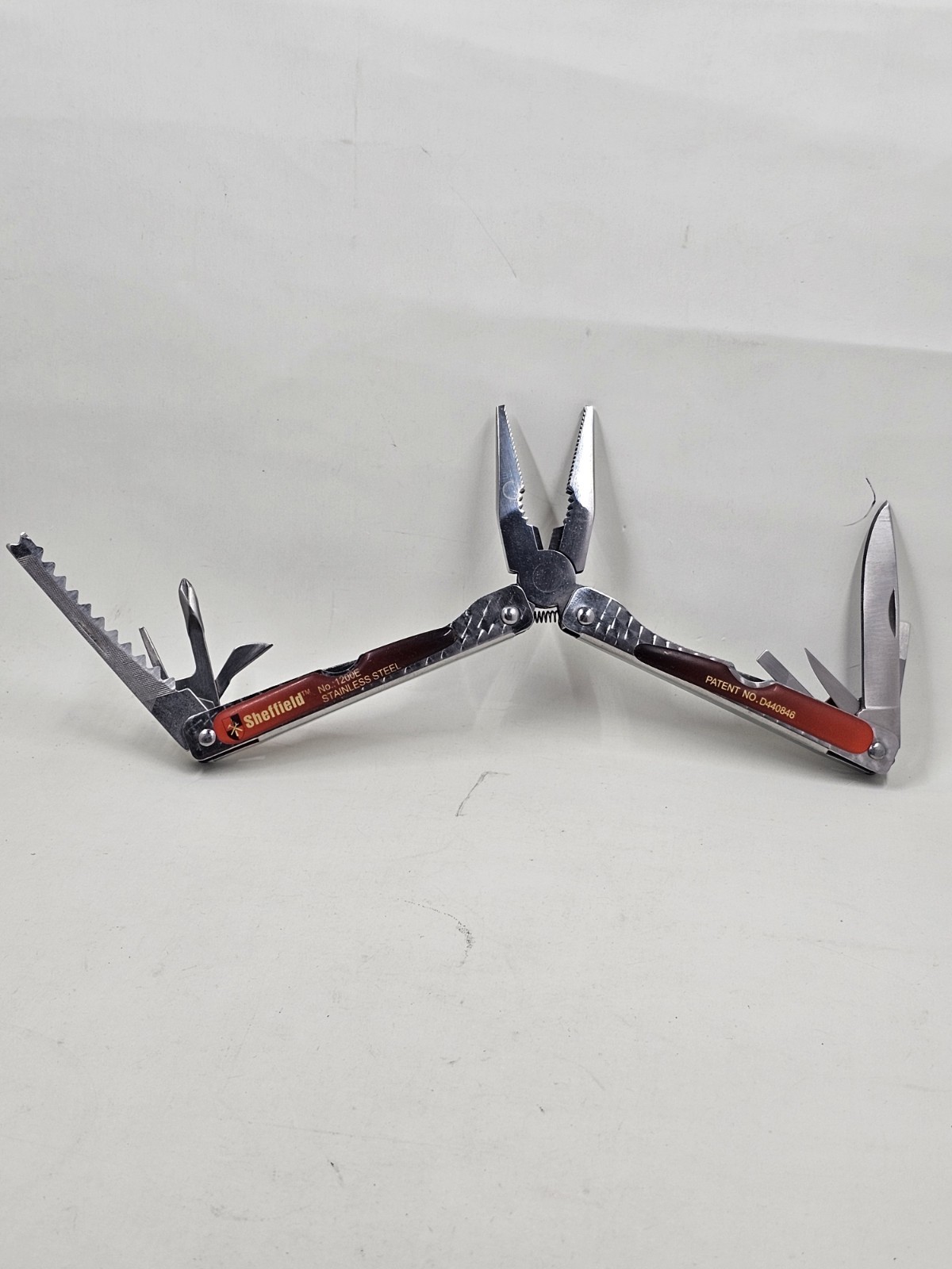 Sheffield No 1200E Stainless Steel Multi Tool Pliers Saw Knife Red Handle 4in