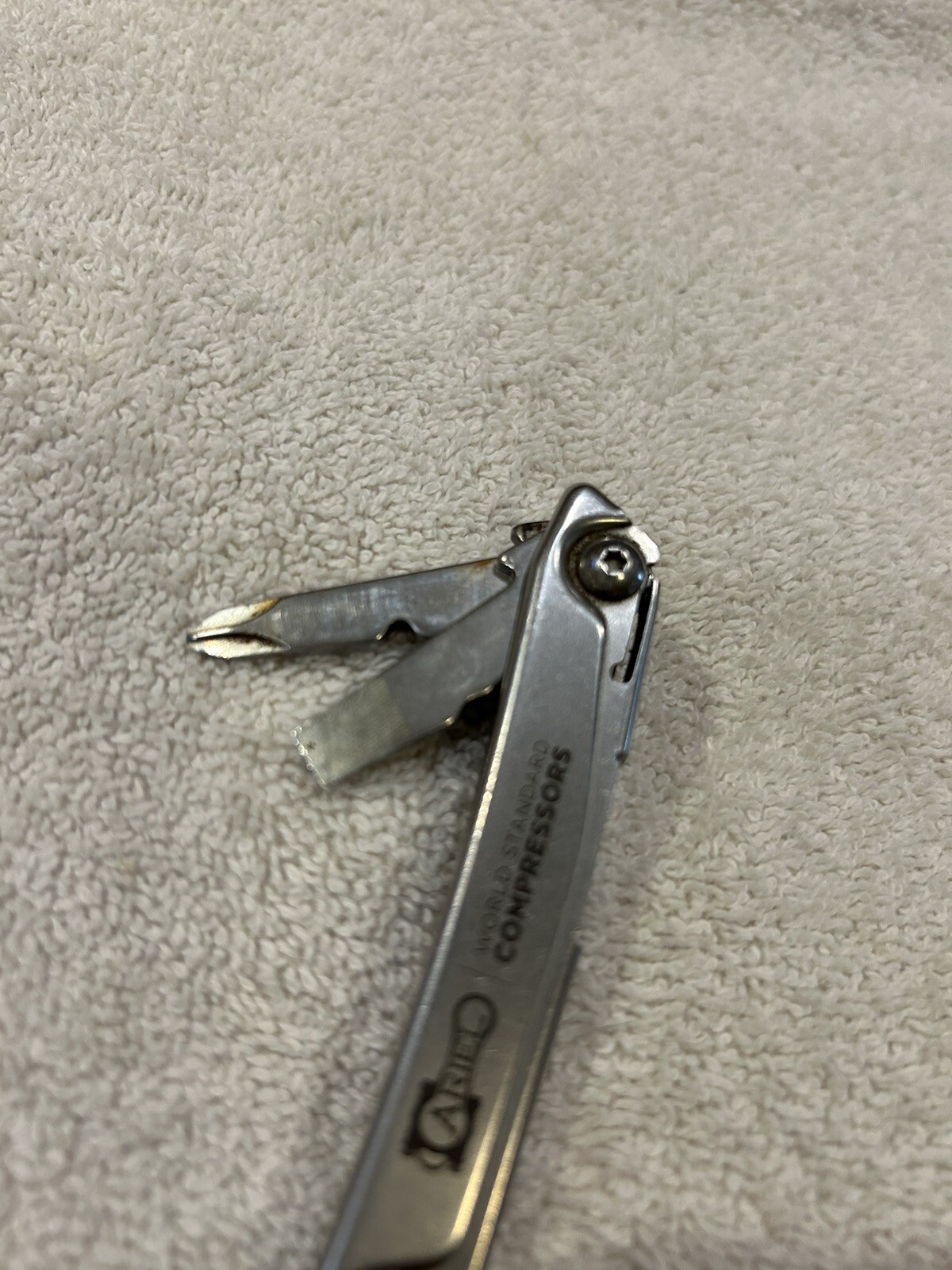 Leatherman Rev multitool with company logo