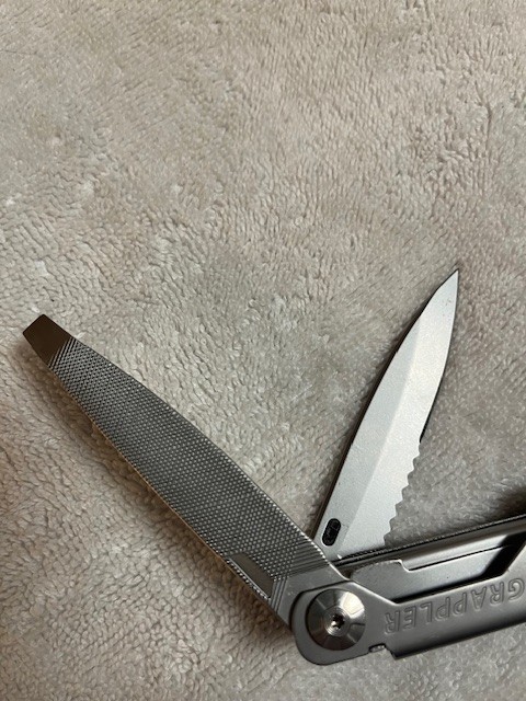 Gerber Grappler Multi tool w/locking pliers. Near Mint condition w/Case