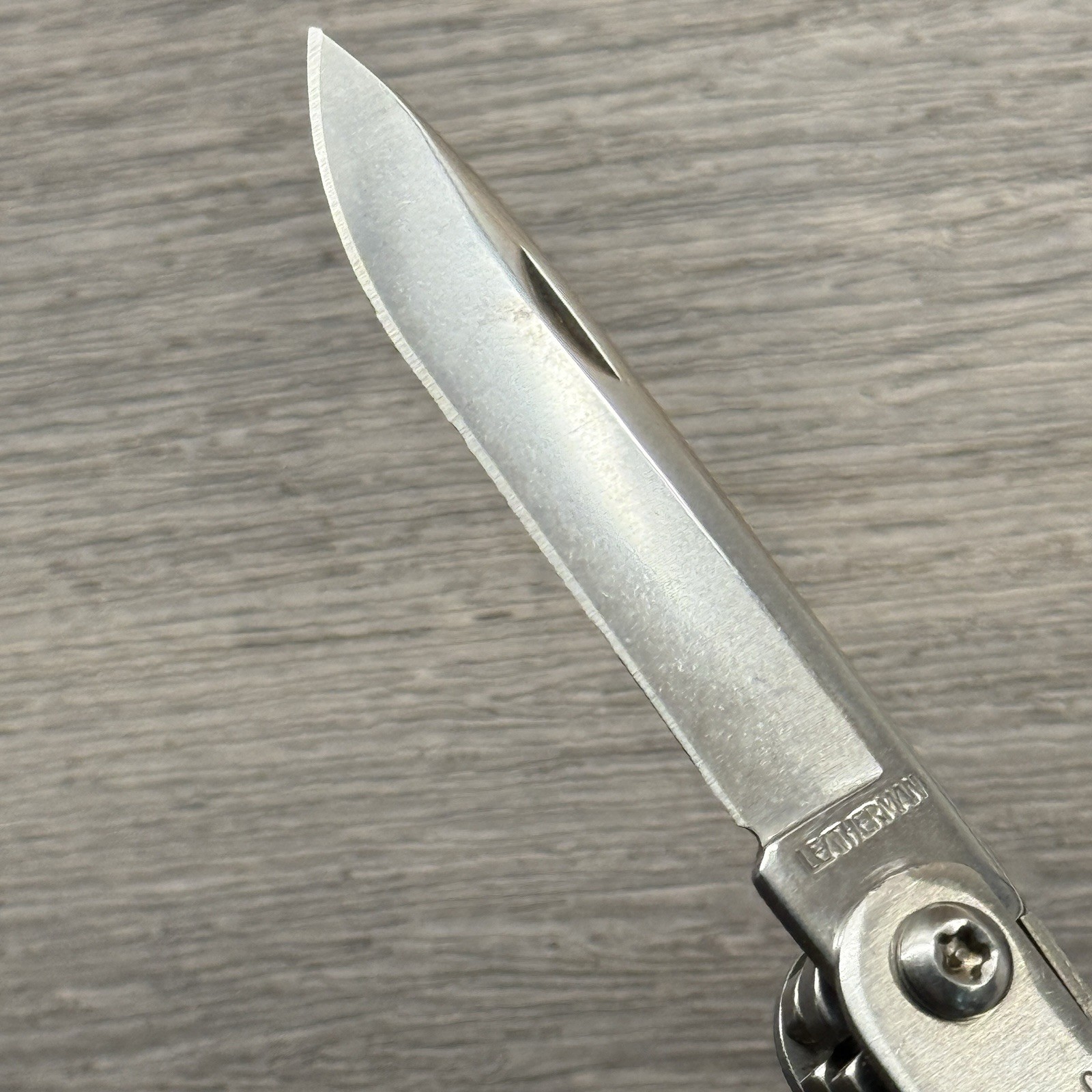 Leatherman Sideclip multitool. Lightly used. Late Run: shiny factory polished