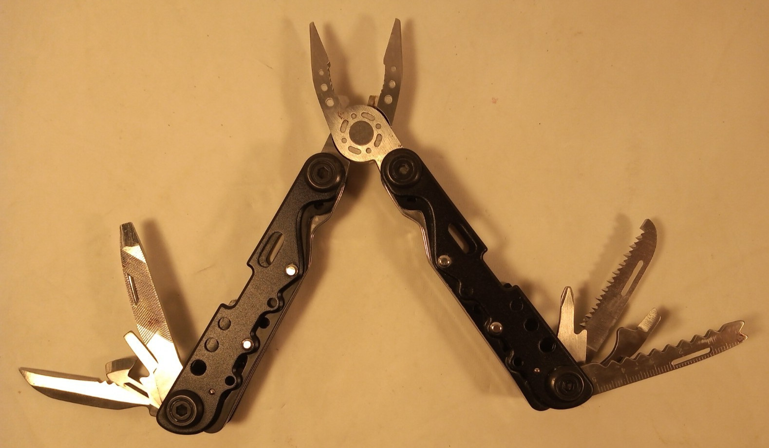 14-In-1 Multi-Tool Pliers Knives Screwdrivers Opener Fish Scaler Saw File Ruler