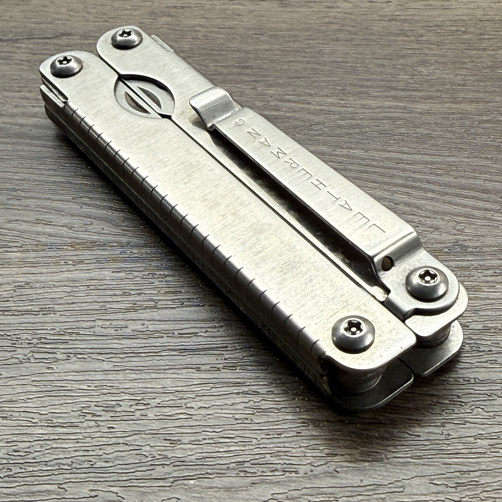 Leatherman Sideclip multitool. Lightly used. Late Run: shiny factory polished