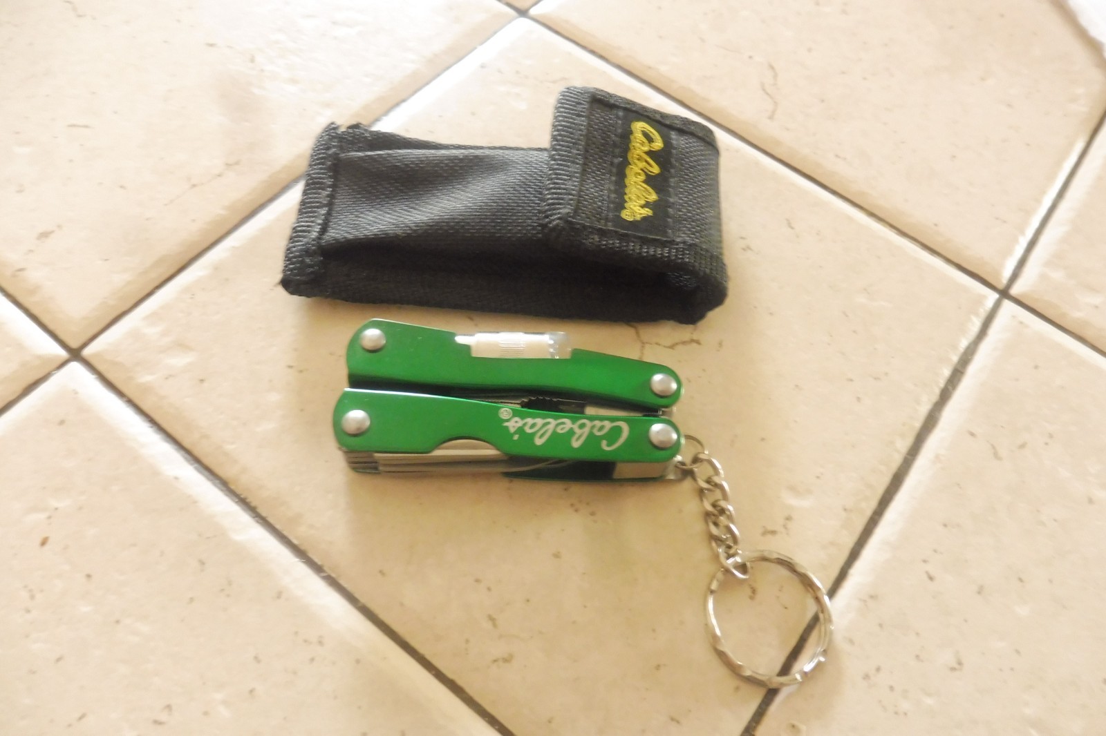 CABELA’S SMALL 7 FUNCTION MULTI-TOOL W/ LIGHT & NYLON SHEATH