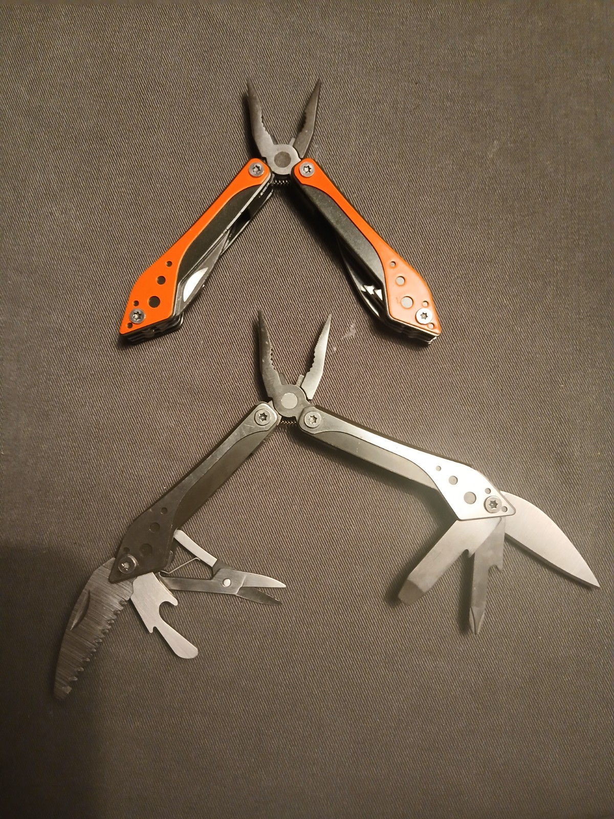 Lot 0f 2 Cabela’s Multi-Tool 1) Silver /1) Orange Unused with Cases