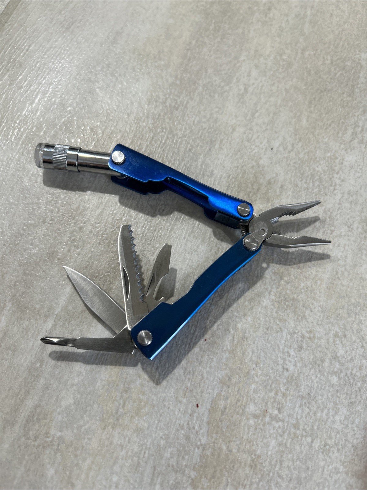 PROTOCOL 8 FUNCTION MINI MULTI TOOL WITH SHEATH – Pliers, Flashlight, Etc.