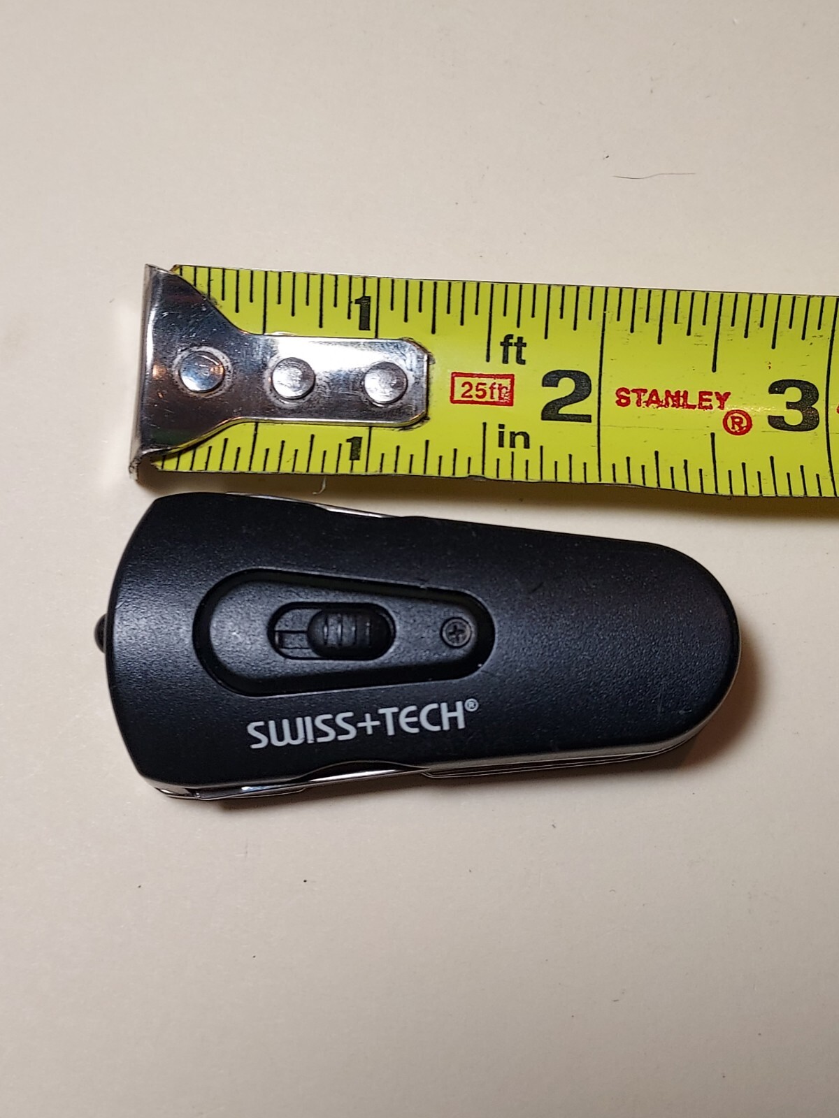 Swiss+Tech Swivel Tool 8-in-1 bottle opener multi tool with light