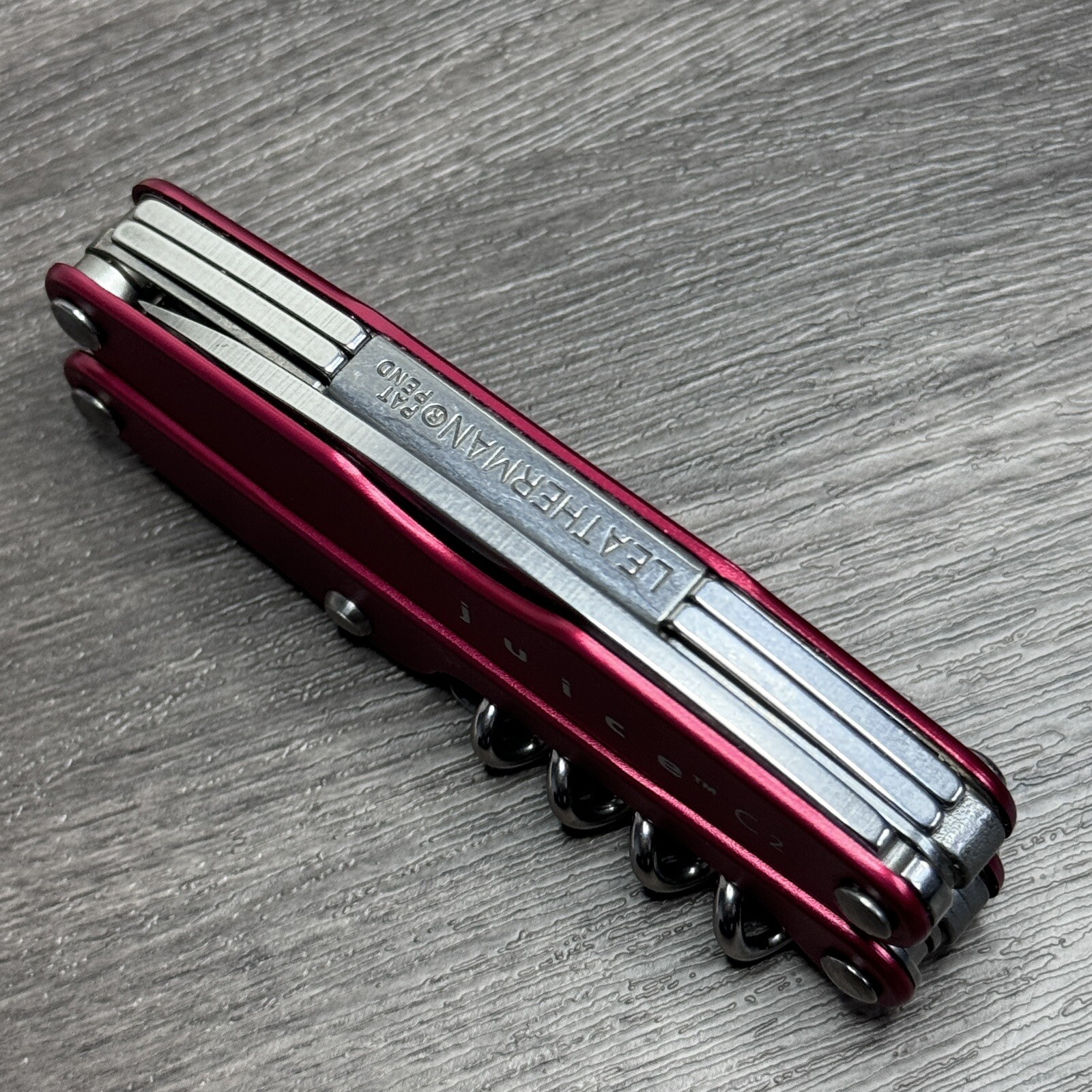 TWO Leatherman Juice C2 Red multitools. TM variants. Discontinued
