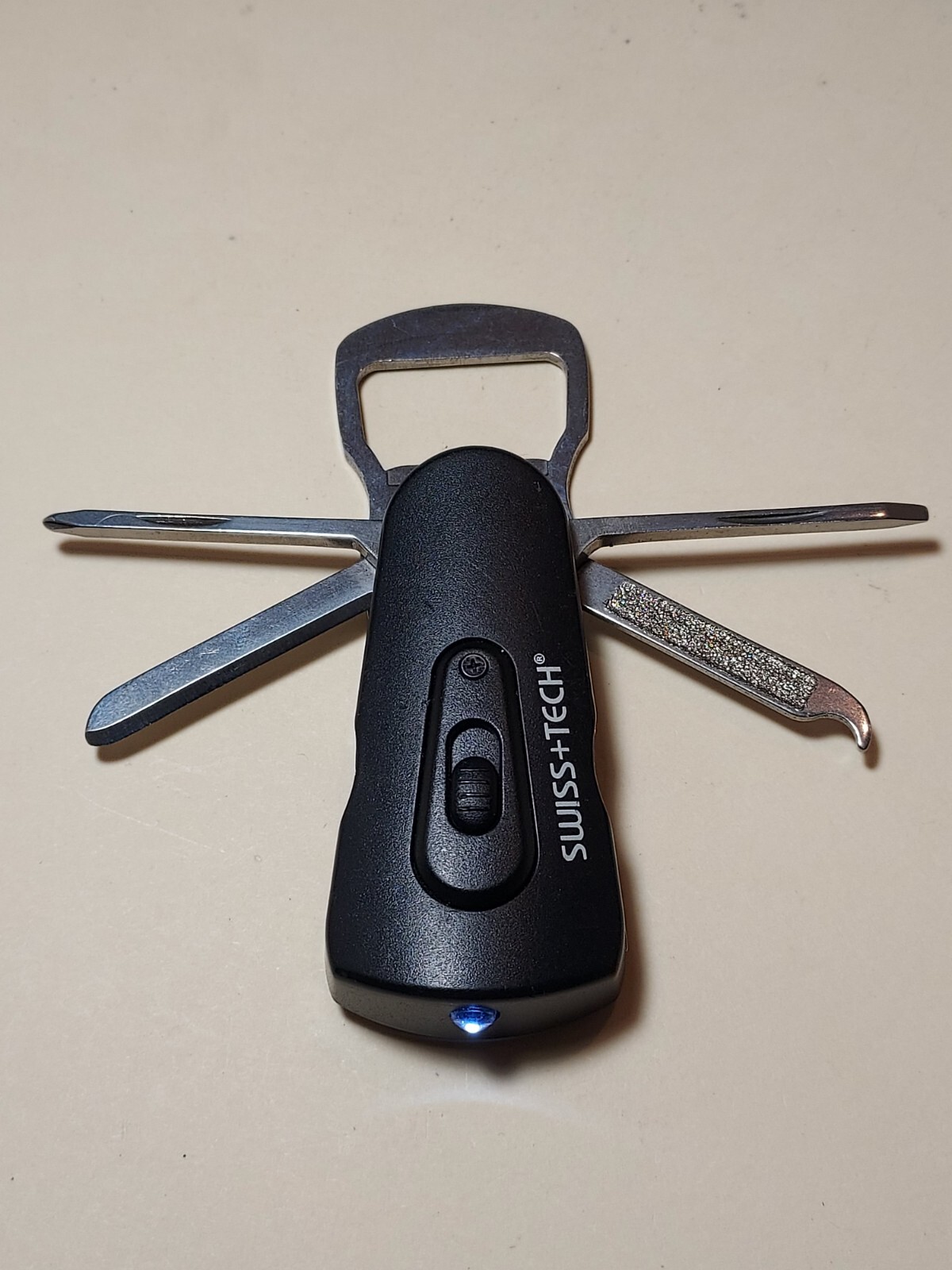 Swiss+Tech Swivel Tool 8-in-1 bottle opener multi tool with light
