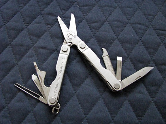 Letherman Multi mini Tool with case.