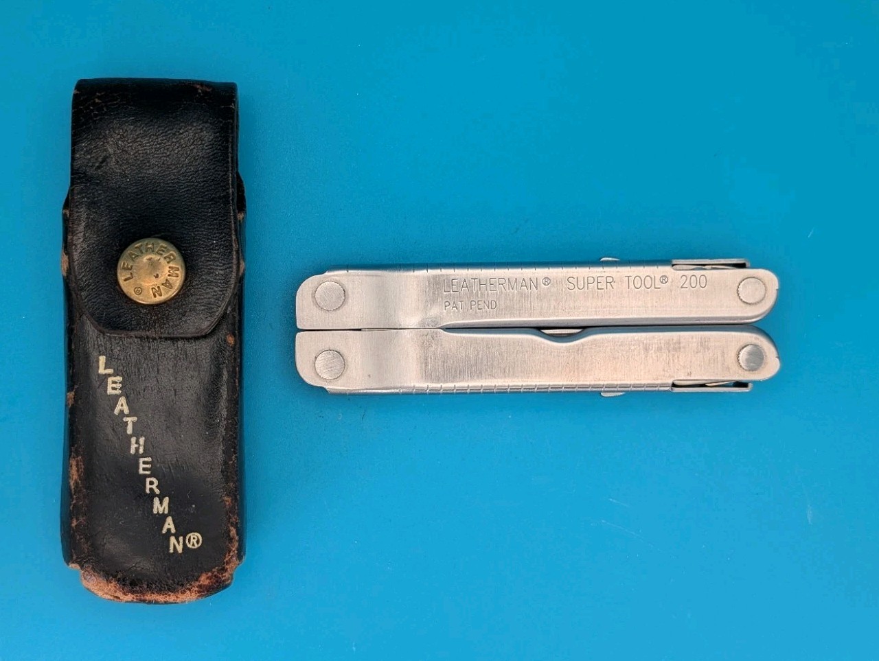 Vintage LEATHERMAN Super TOOL 200 Multi Tool! 02/04 Date Stamp! With Sheath!