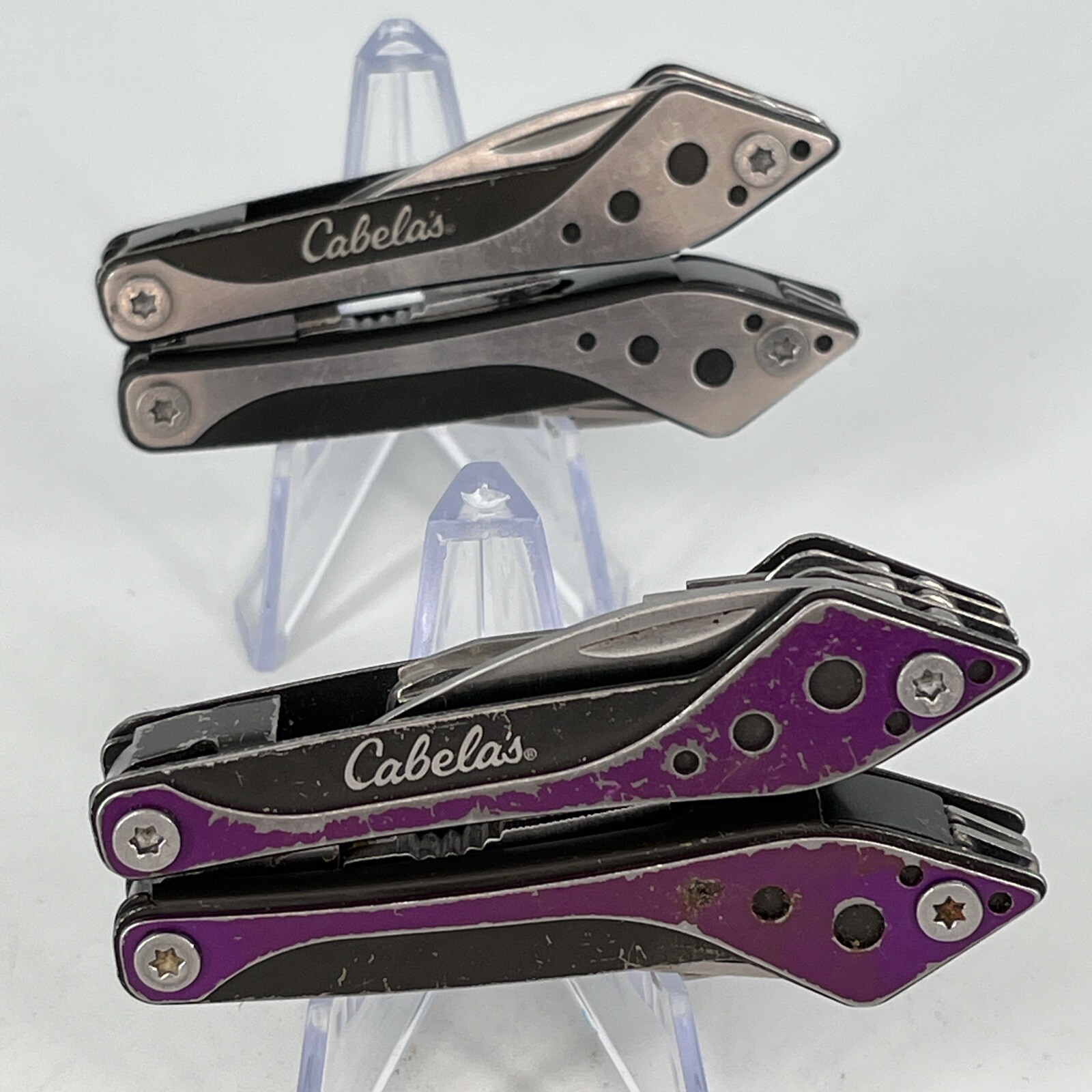 LOT OF 2 Cabela’s PURPLE & SILVER Mini MultiTool Spring Open Pliers Scissors Saw