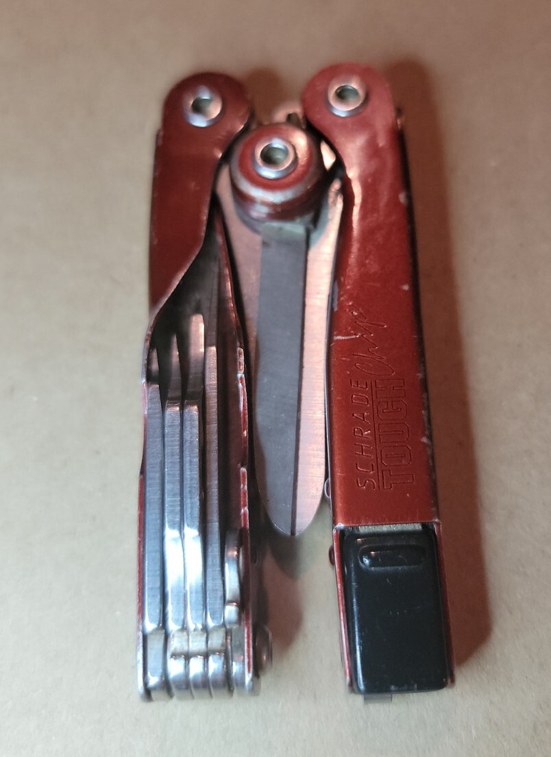 Red Schrade Tough Chip 10 In 1 Compact Multi Tool Screwdriver