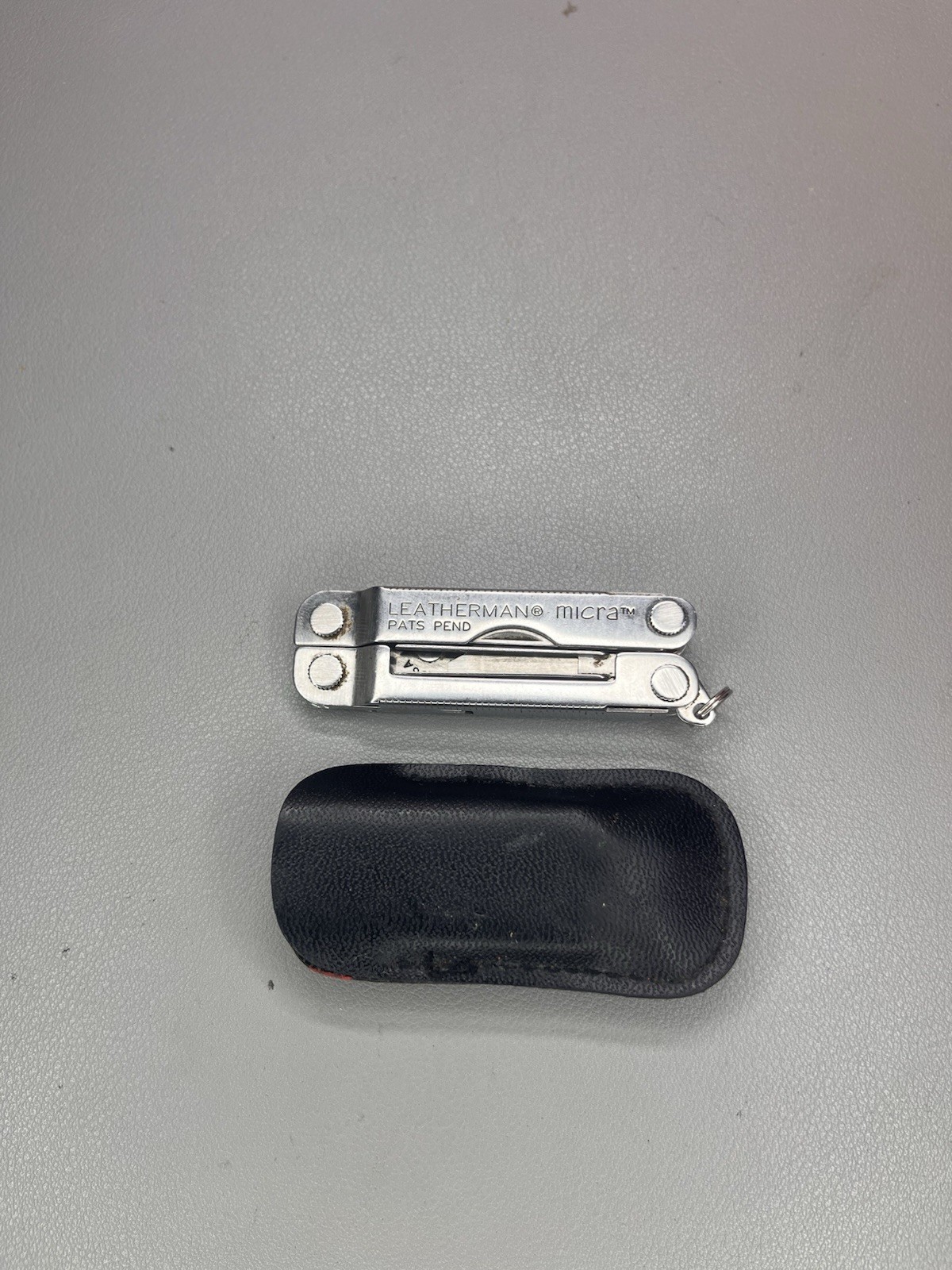 Leatherman Micra keychain multi-tool with sheath. USA