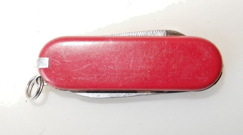 Unbranded Chinese Knock-Off red multitool, tweezers, toothpick