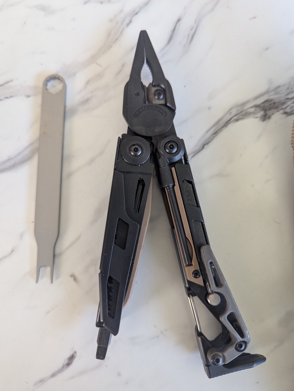 Leatherman MUT Black multi tool with Brown/Tan Inserts. Very good condition.