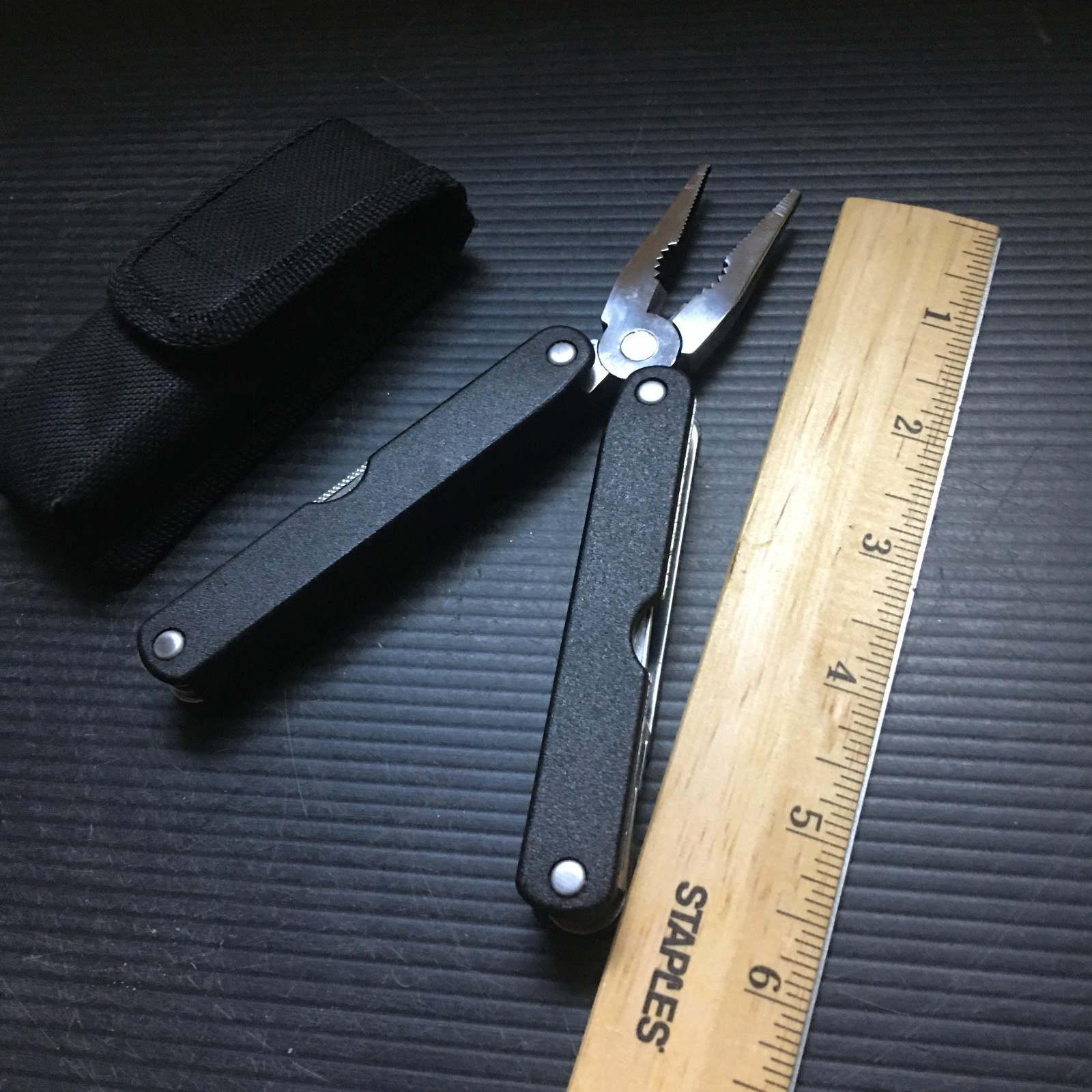 RACO 10-in-1 Multi-Tool with Pliers, Knife, Ruler & Saw in Black Nylon Sheath